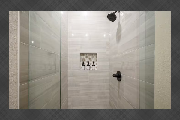 Spacious tiled shower with premium finishes