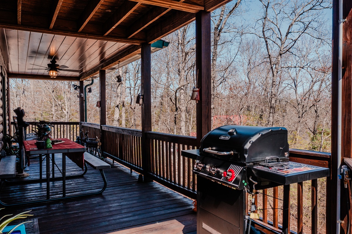 Gas barbecue grill on the deck along with seating to enjoy the food with family and friends