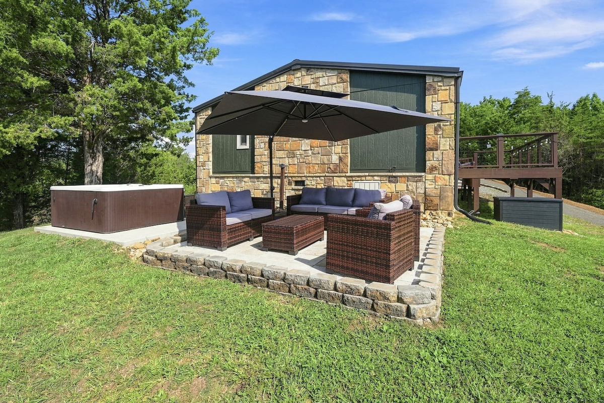 Step from the hot tub to the shaded outdoor lounge—your own private space to relax and reconnect.