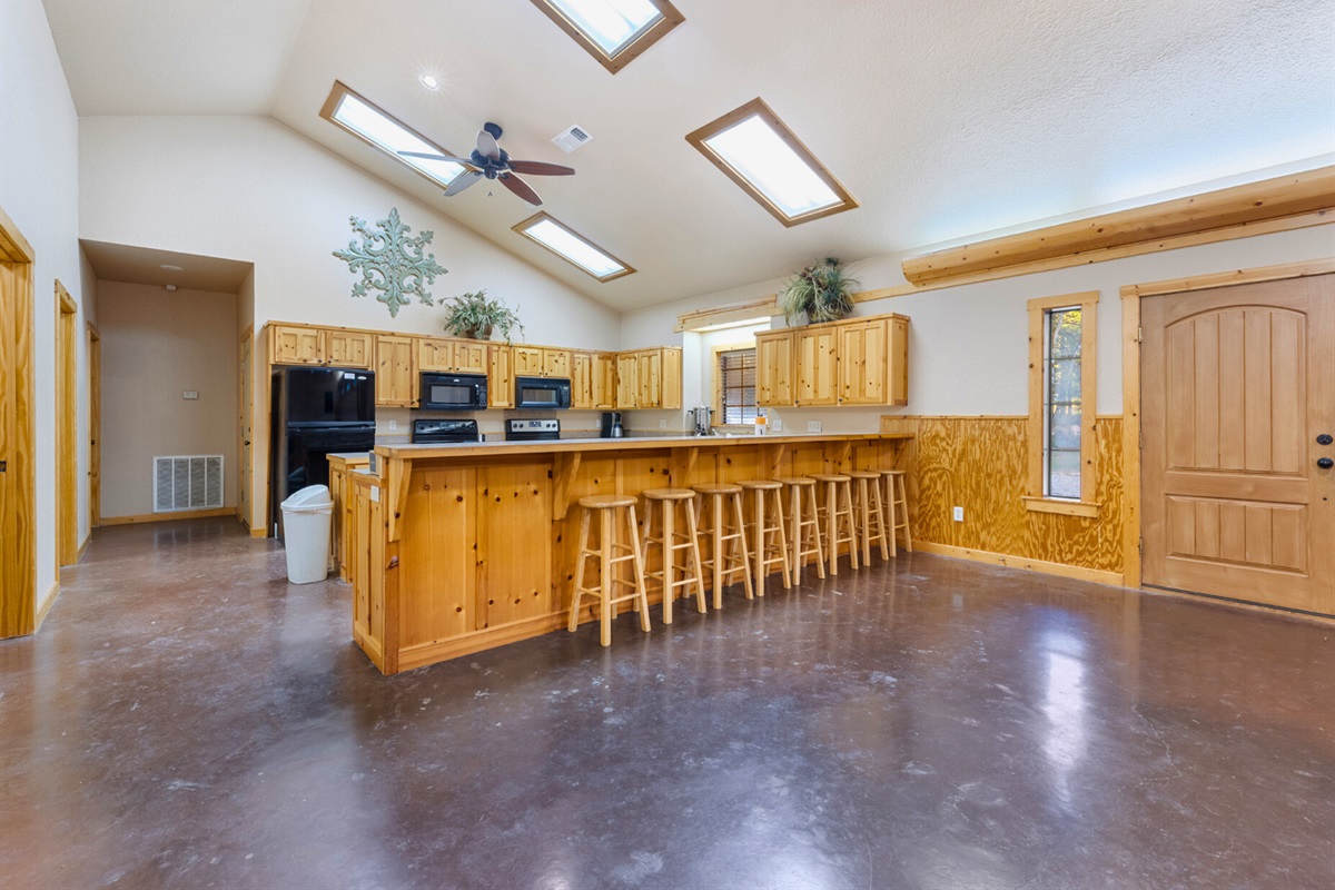 Inside, the open kitchen and dining area create a welcoming atmosphere for shared meals and conversation.