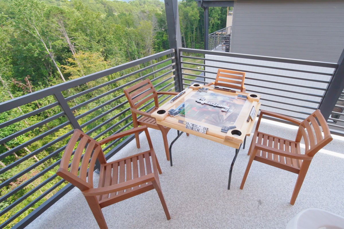 Enjoy a game of dominoes on the rooftop terrace with stunning mountain views and fresh mountain air.