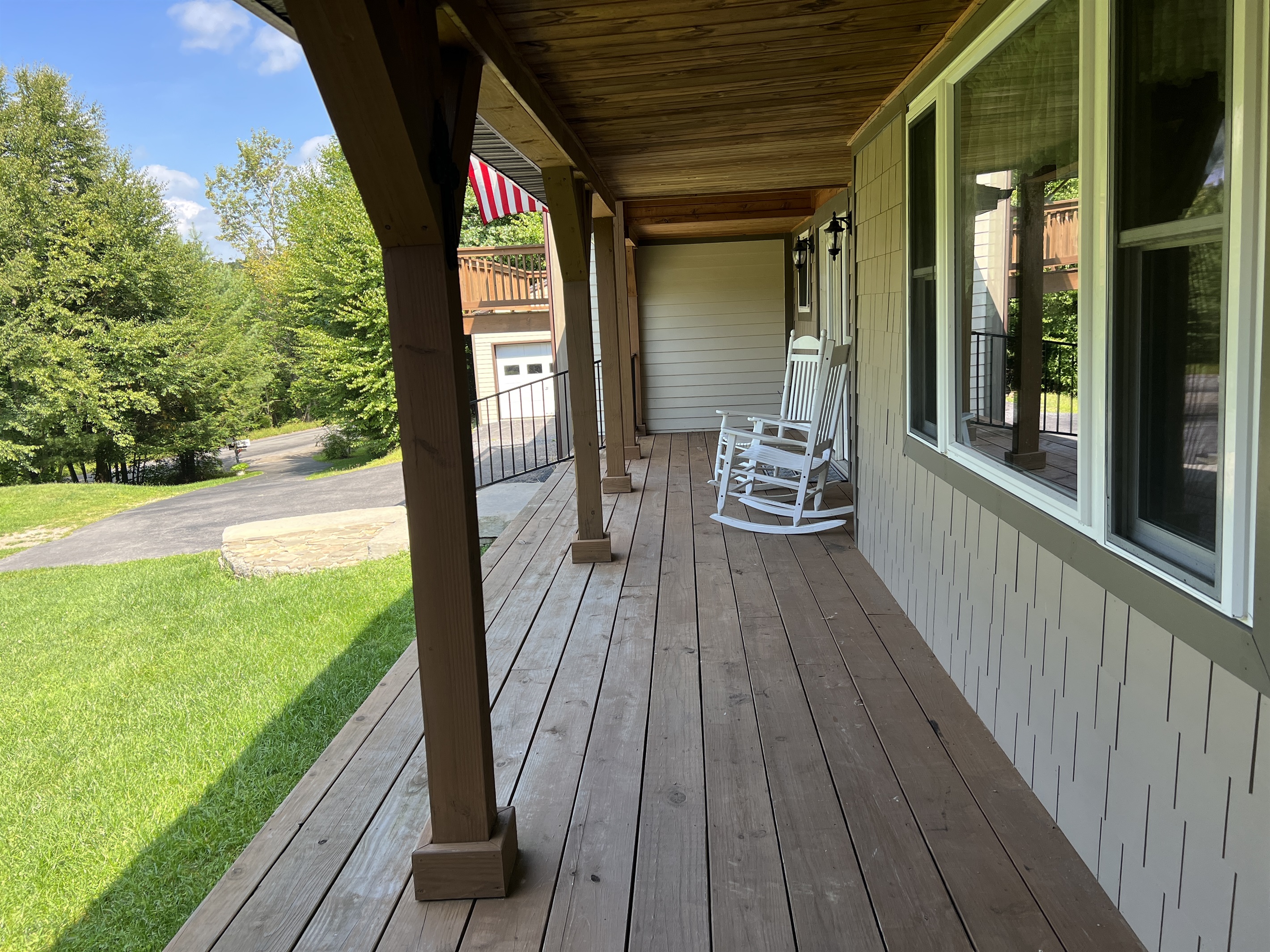 Large front porch with seating for both units.