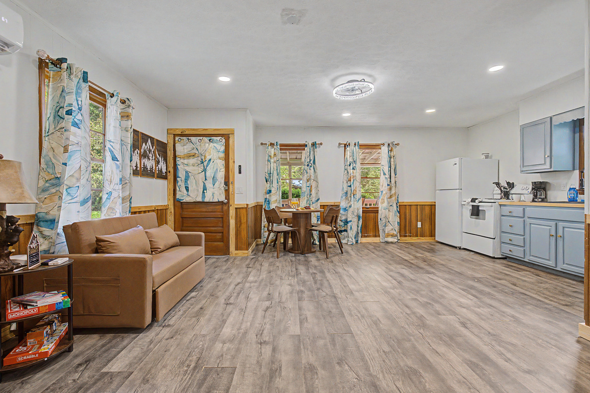 Living Room: Bright and airy space, perfect for games and relaxation with scenic views!