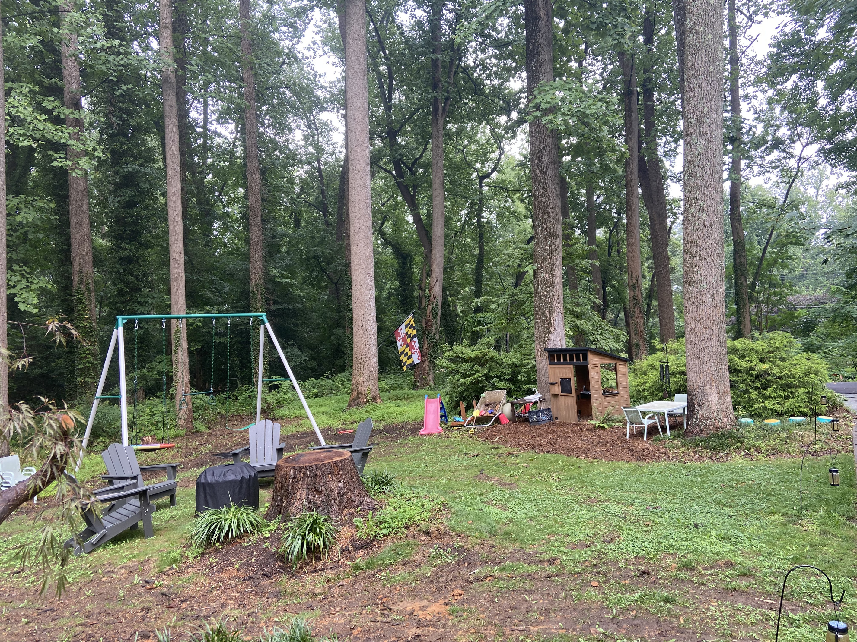 Kids can enjoy the swing set, play house and mud kitchen in the shared yard.