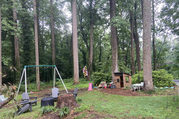 Kids can enjoy the swing set, play house and mud kitchen in the shared yard.