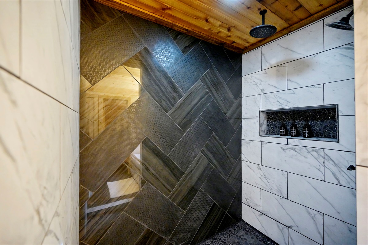 Walk-in tiled shower with modern fixtures and luxury details 🚿