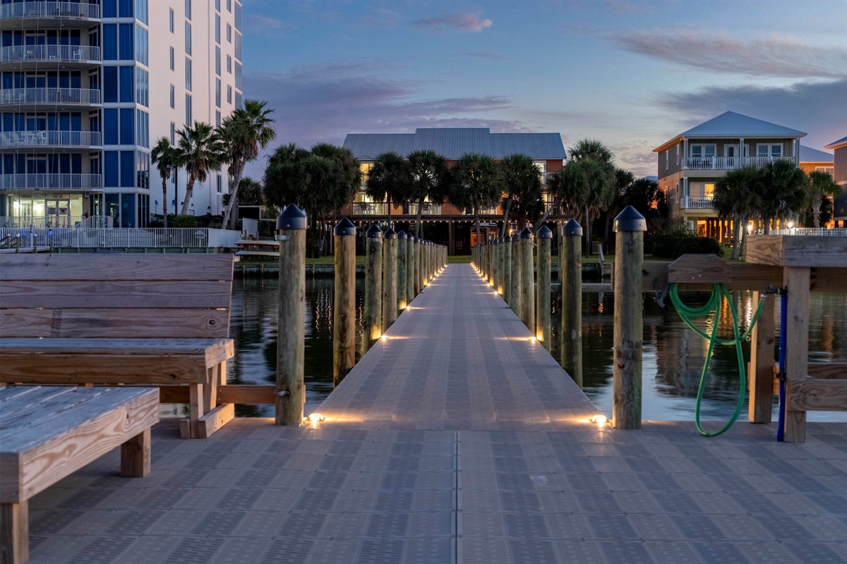 Relaxing sunset dock with cozy benches and peaceful waterfront vibes.