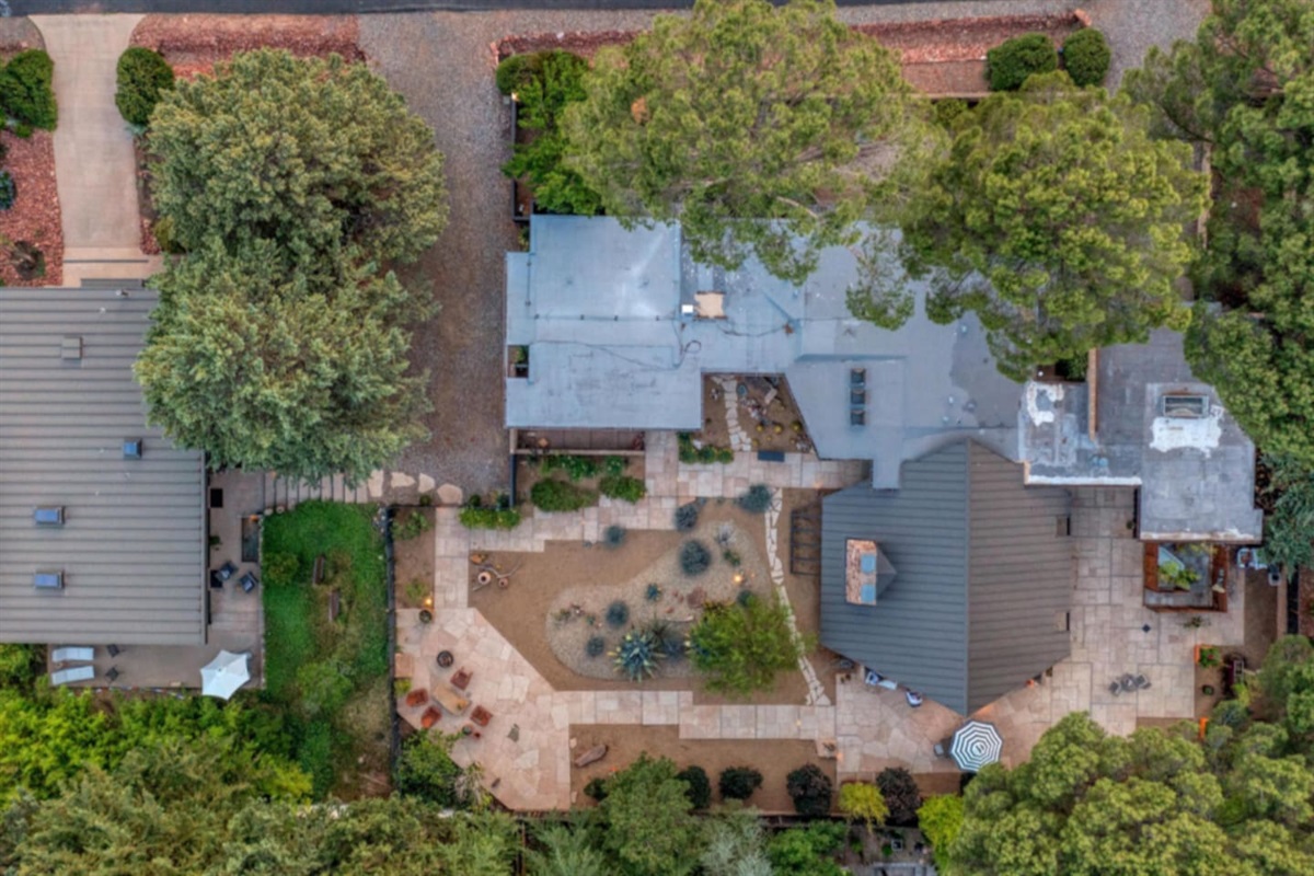 Aerial view showcasing the home’s unique mid-century layout, expansive patios, and beautifully designed desert courtyard.
