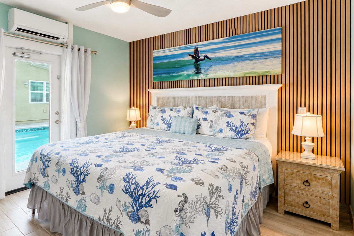 Master Bedroom of Pelican Suite with direct Pool Access  at AMI Beach Lagoon