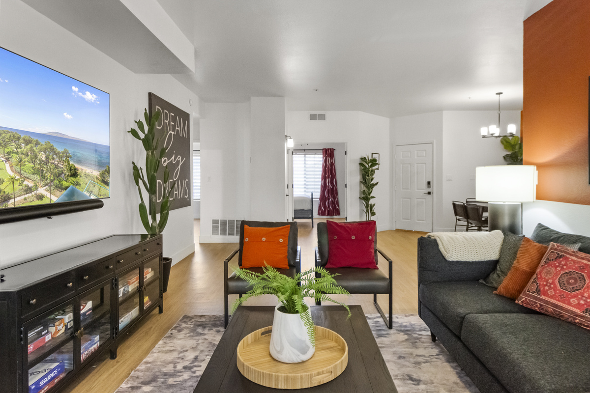 Bright living room with a cozy sofa, Roku TV, and fast Wi-Fi.