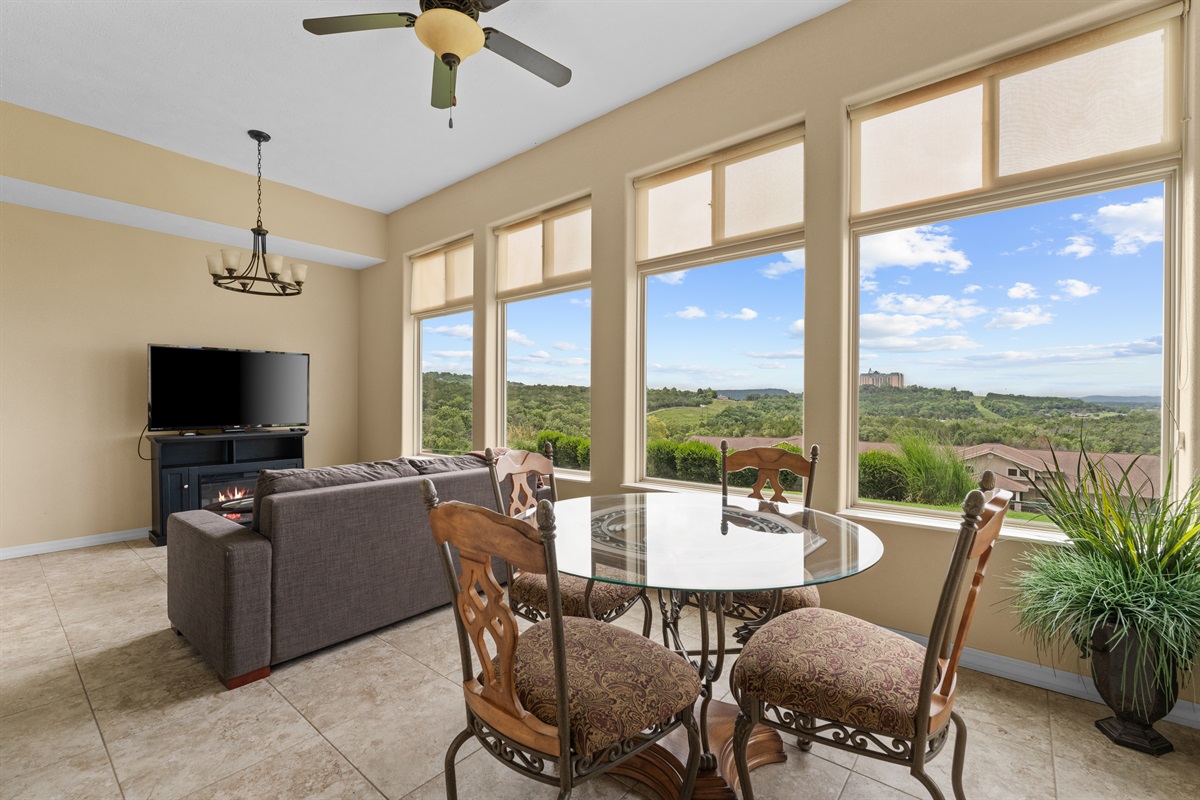 This climate-controlled sunroom is the star of the condo—coffee, cards, and lake views in every season.