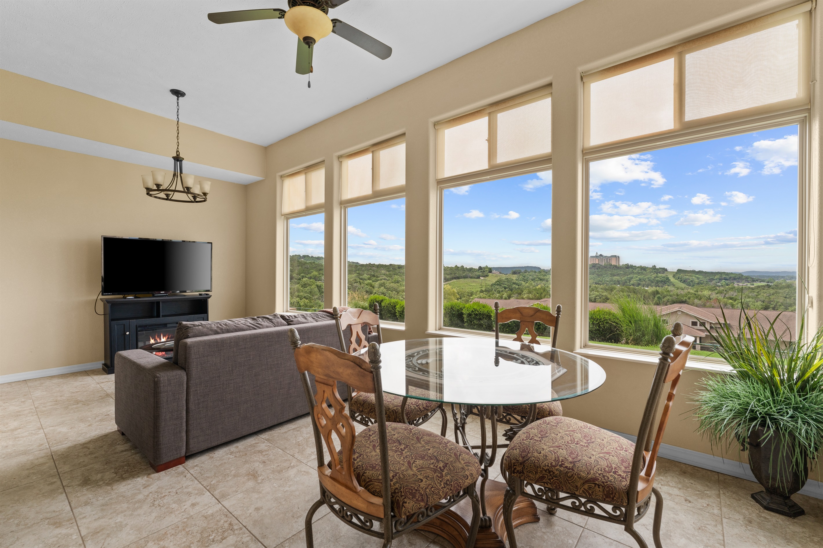 This climate-controlled sunroom is the star of the condo—coffee, cards, and lake views in every season.