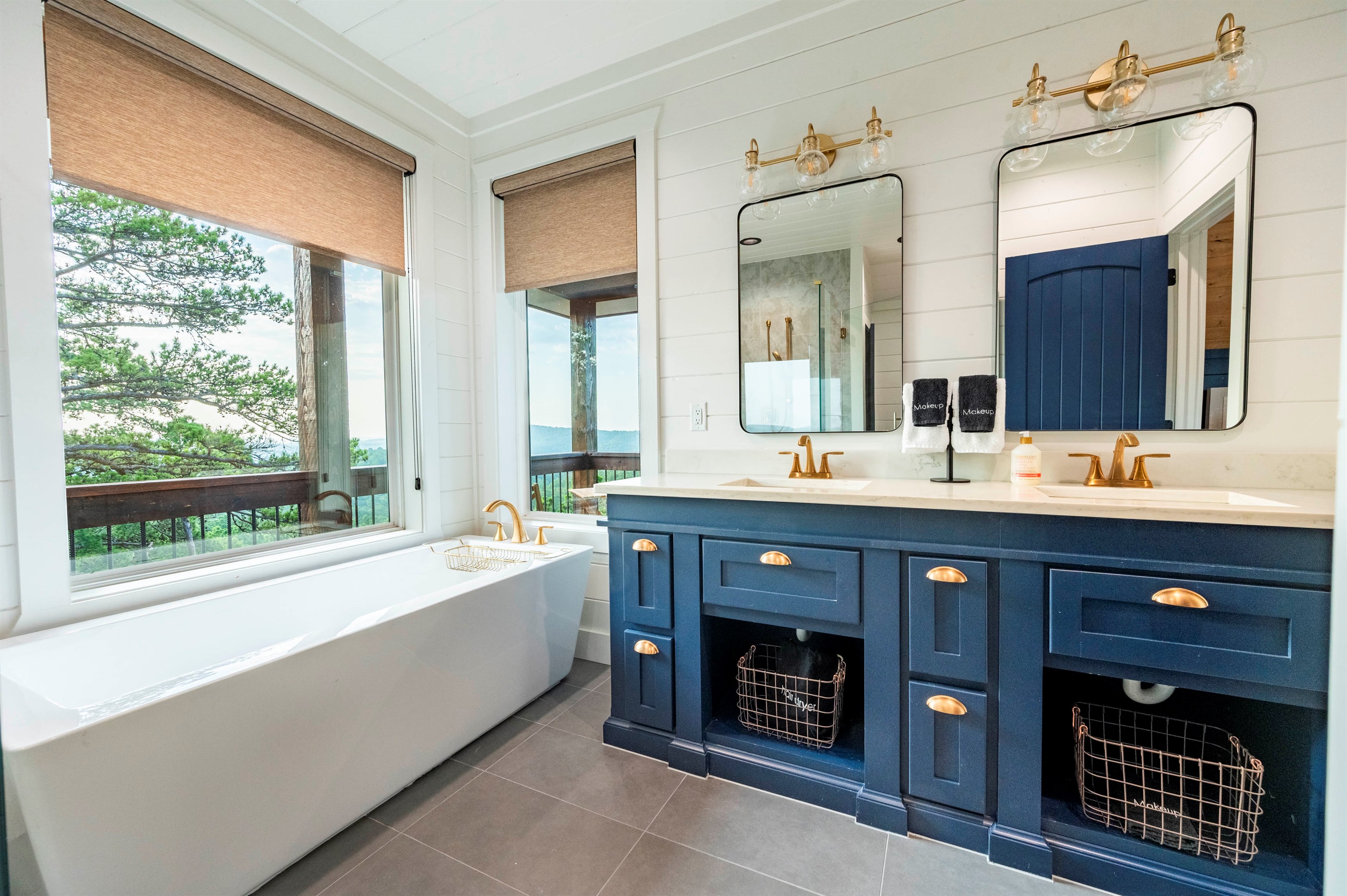 Bright and elegant bathroom with soaking tub and scenic outdoor views