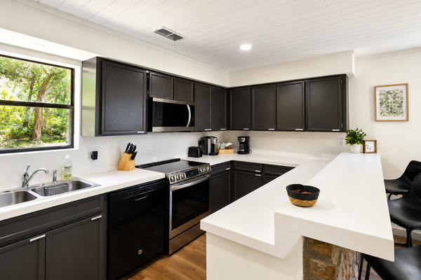 Full kitchen with ample counter space and storage.