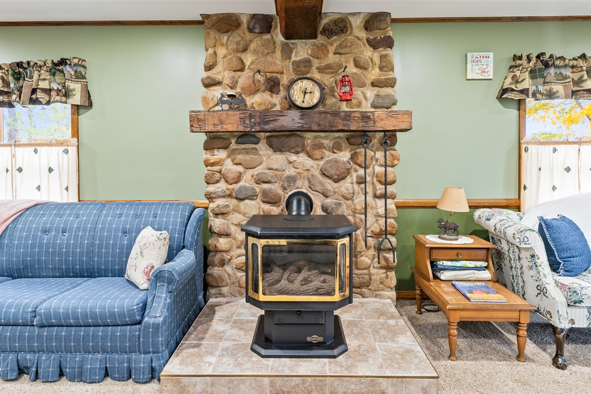 Rustic stone fireplace adds the perfect touch of warmth and coziness for evenings in with a glass of local wine.