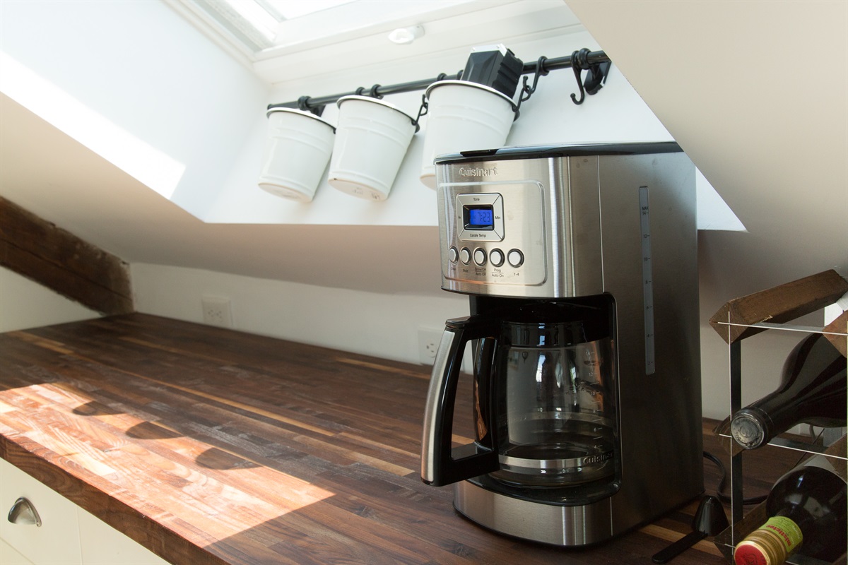 Kitchen Delight: Brew your morning coffee under sunlit skylights, perfect for culinary adventures!