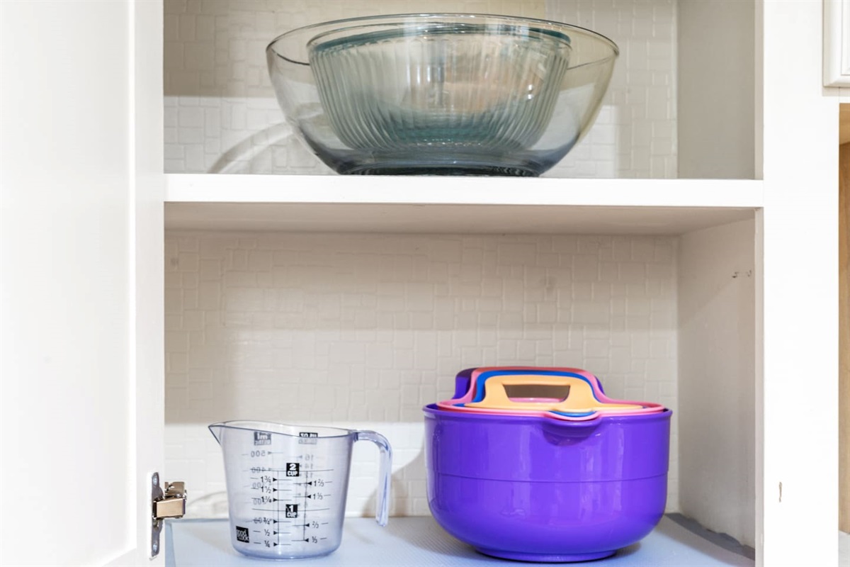 This home comes equipped with mixing bowls, measuring cups, and all the kitchen basics you need for meal prep, baking, or cooking in.