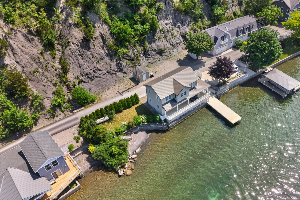 Property tucked between the lake and rock ledge