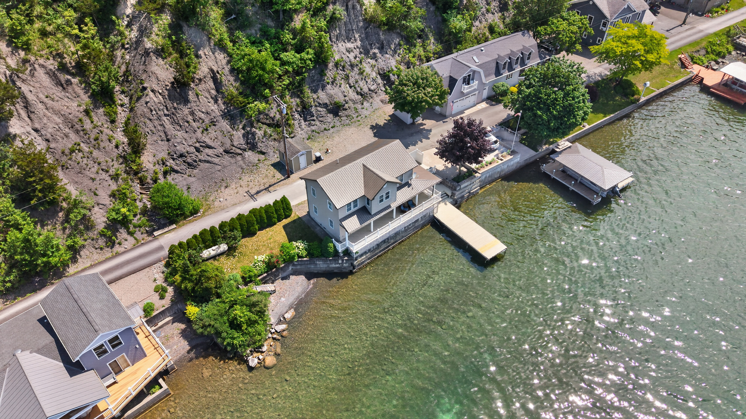 Property tucked between the lake and rock ledge