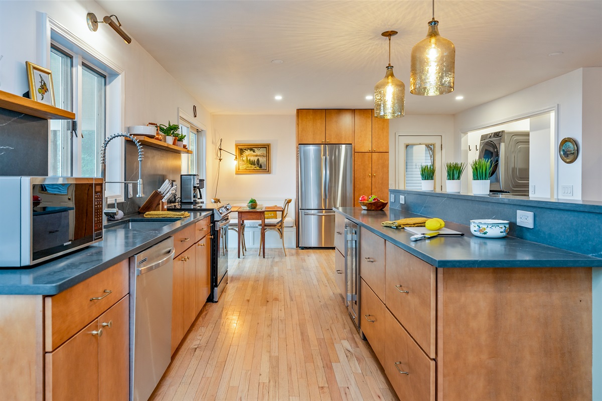 Sleek countertops, open shelving, and natural light make this modern kitchen a dream for home-cooked meals and entertaining.