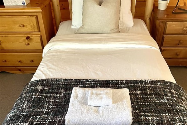 In addition to the queen bed there are two additional twin beds in the top floor bedroom. 