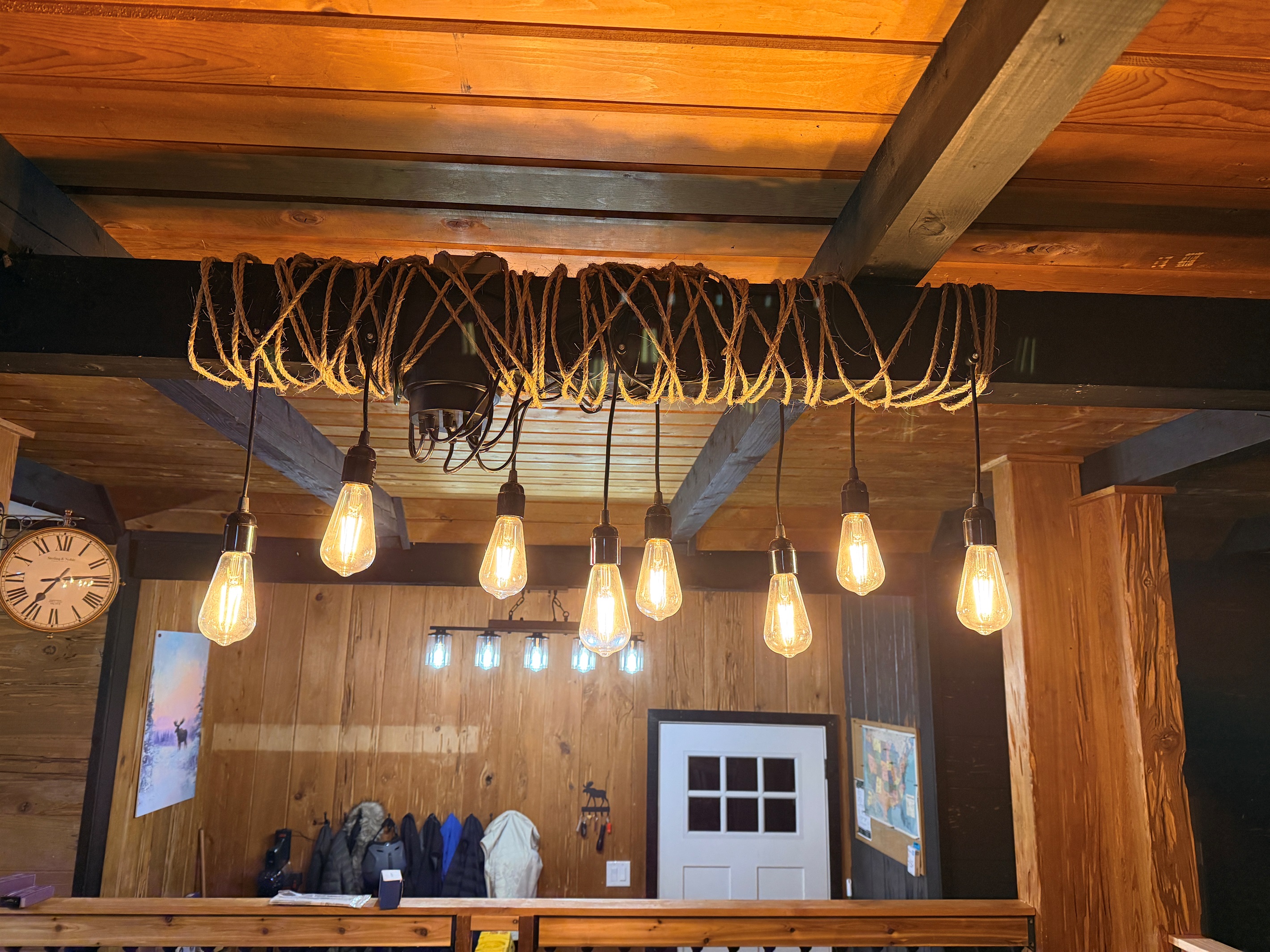 The dining area, with seating for everyone, overlooks the entryway. To the left, you'll see the stream outside the windows, and to the right, beyond the stone fireplace, you'll see Mt Argentine, one of Summit County's fourteeners!
