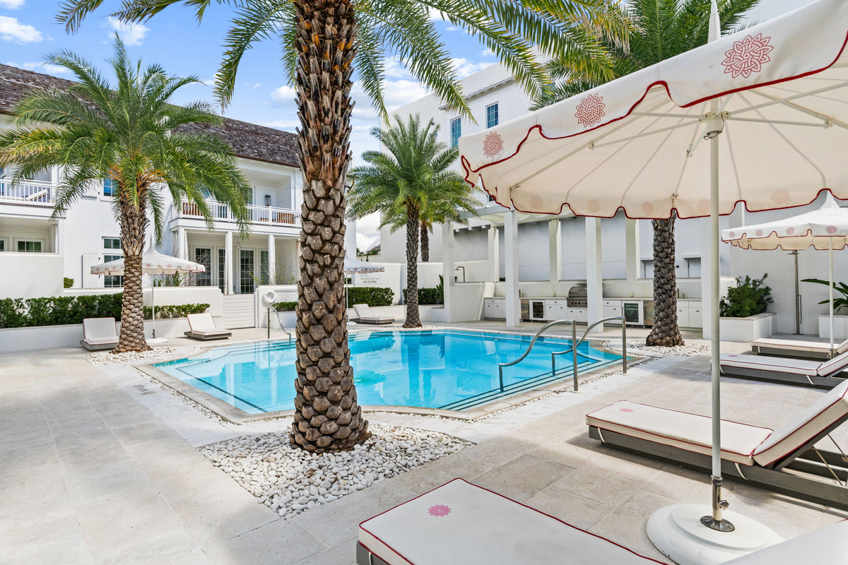 The community pool is just outside the front door, offering a lovely grilling area and lounge areas.