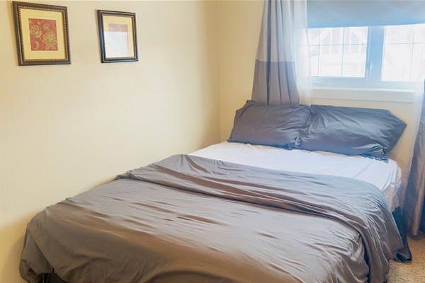 Queen sized bed, full closet and black out curtains.