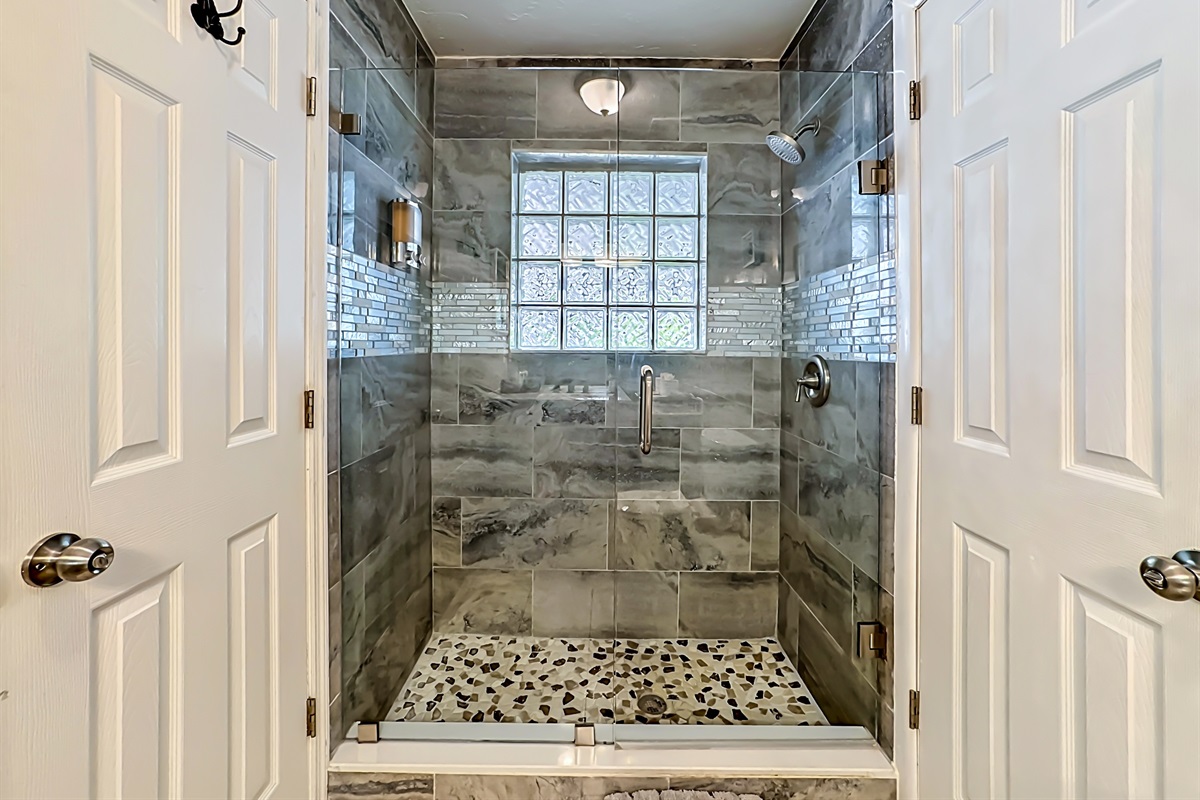 This 3rd bathroom features a stand-in shower.