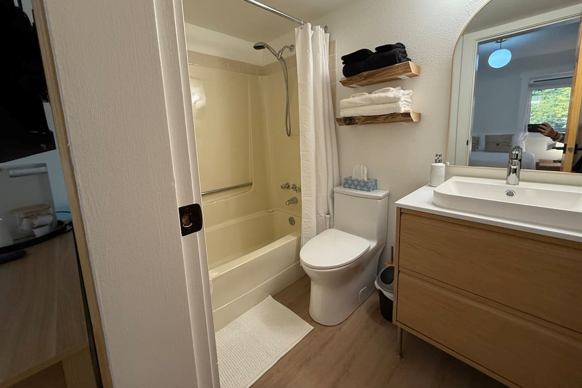 Bathroom Details: Includes a new comfort-height toilet and a clean shower/tub combination, with thoughtful storage solutions provided.

