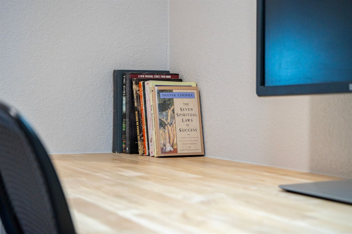 Curated books and a quiet workspace create the perfect spot to unwind or stay productive.