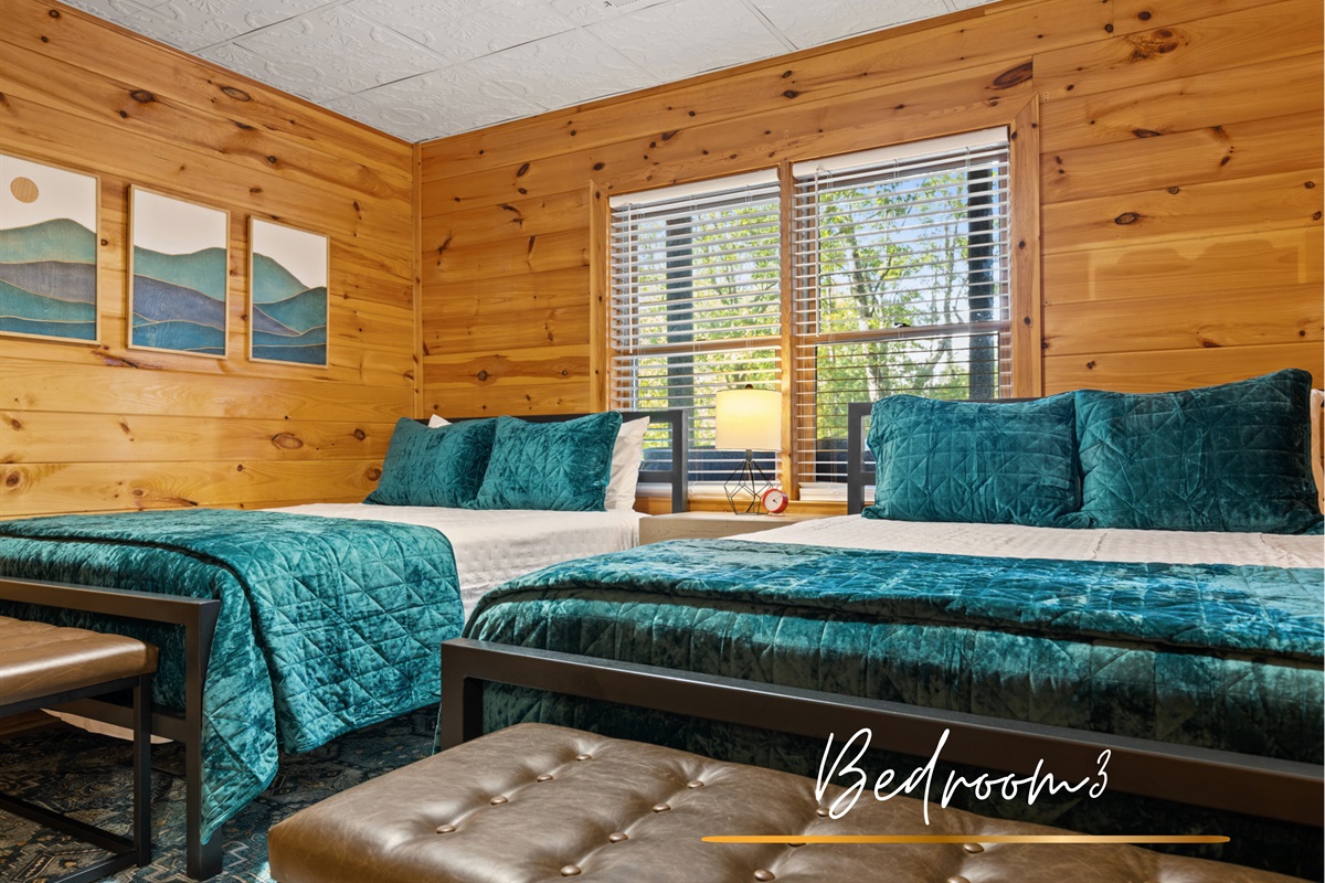Twice the comfort, twice the charm... two queen beds wrapped in rustic wood and chic details.