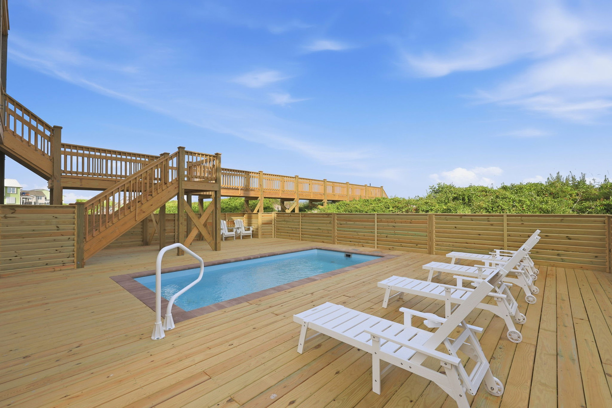 Private pool deck with lounge seating made for sun-soaked afternoons and effortless coastal living