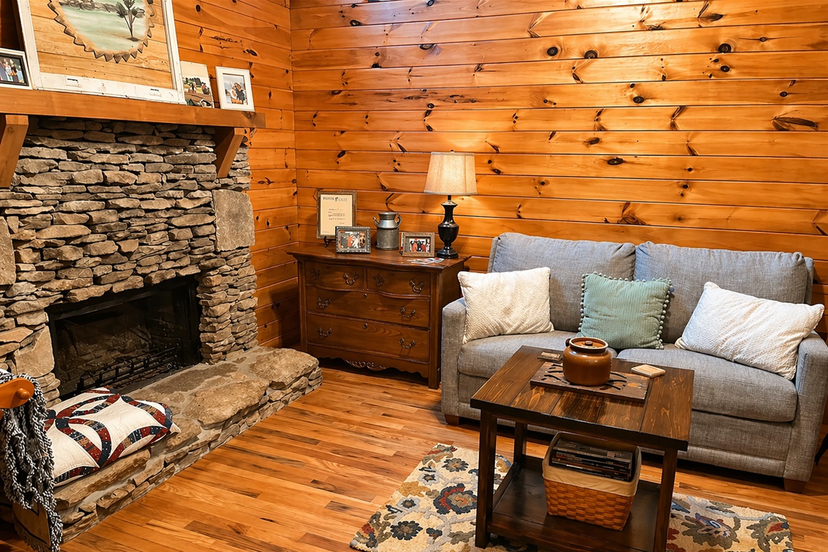Cozy living room with pull out couch for additional sleeping. Please note: the fireplace is not operational.