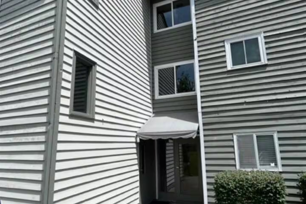 Enter the left side door under the awning