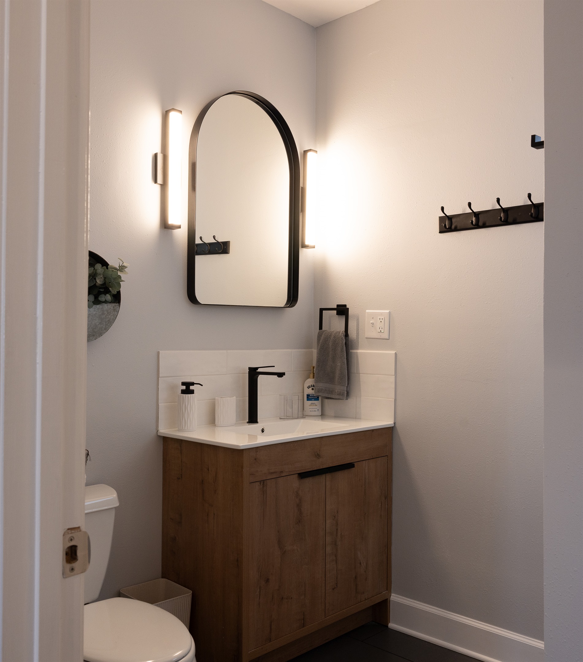 Main Floor Bath. Designer vanity, makeup lights and plenty of storage.