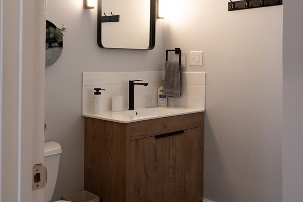 Main Floor Bath. Designer vanity, makeup lights and plenty of storage.