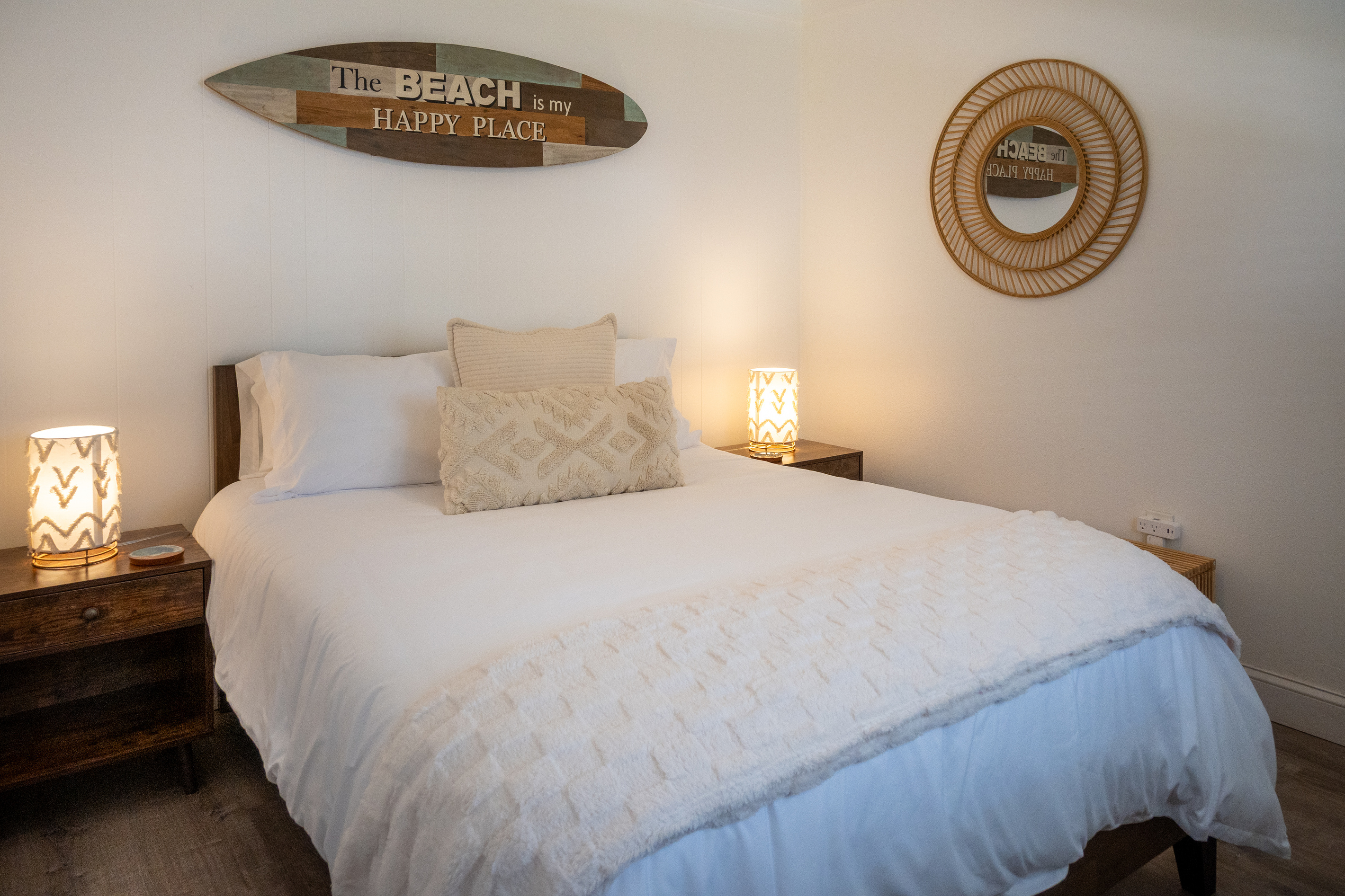 Crisp hotel-quality linens and soft lamplight for easy beach nights