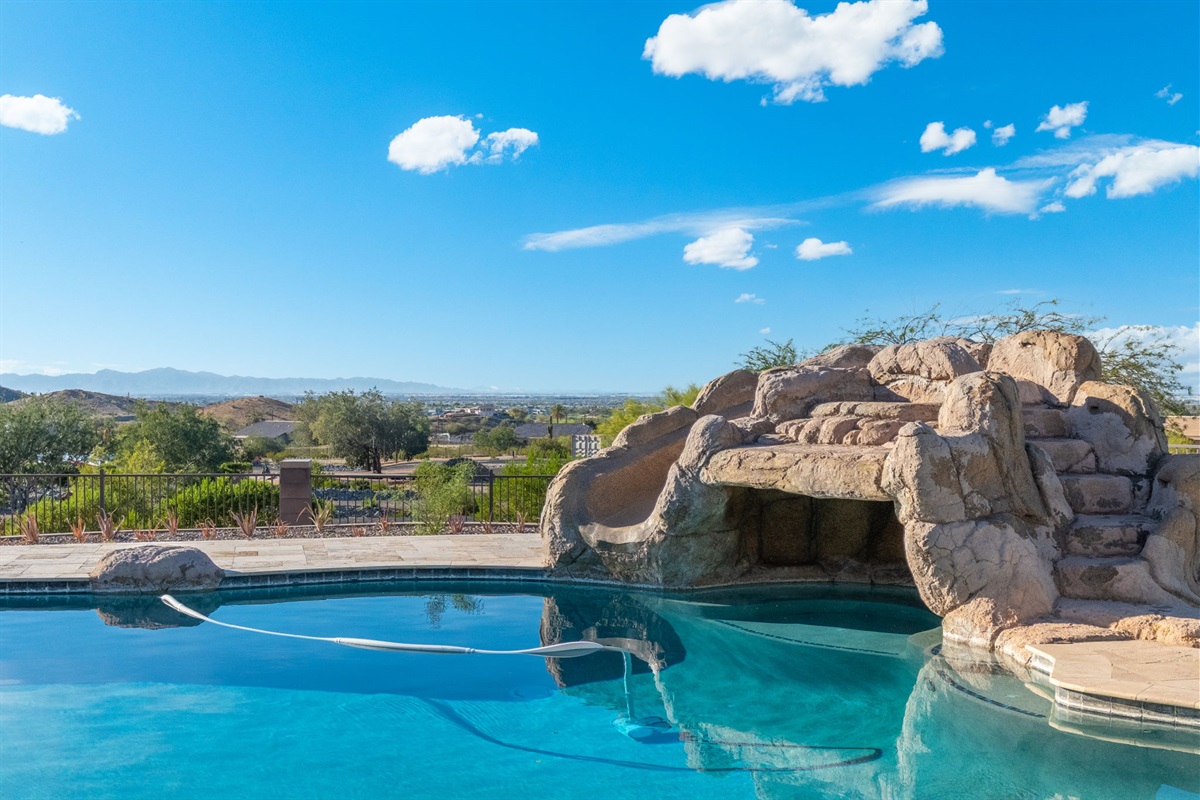 Custom rock waterfall pool design adds a unique desert-retreat atmosphere guests remember long after their stay