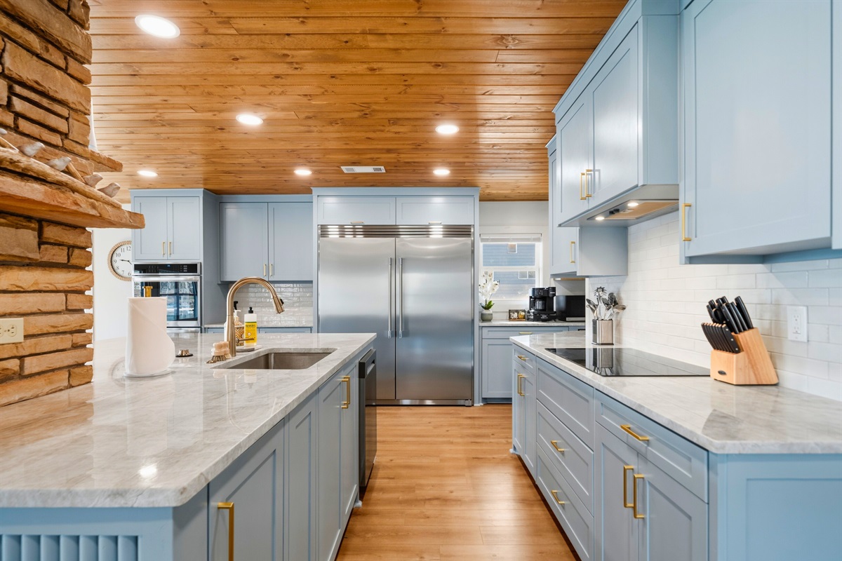 The spacious kitchen layout includes generous prep areas and updated appliances, giving everyone plenty of room to cook and move around comfortably.