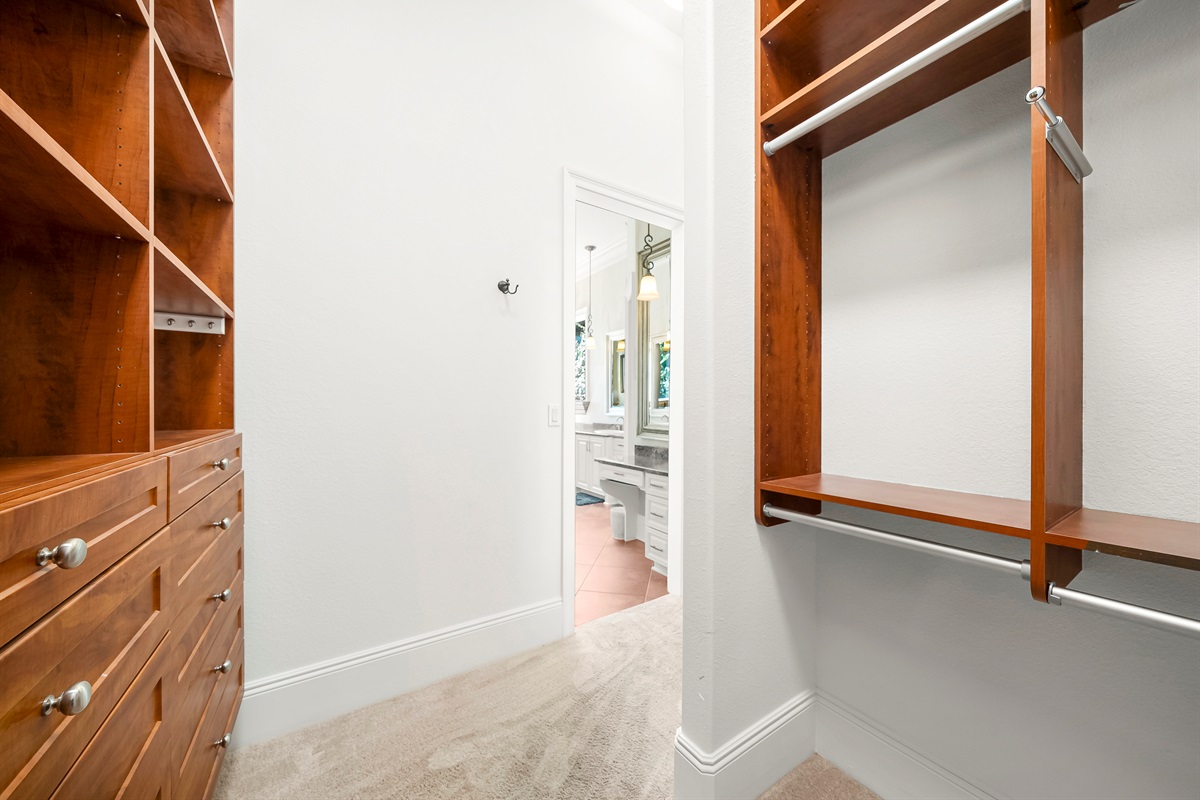 His & Hers walk in Closets full of Cabinets