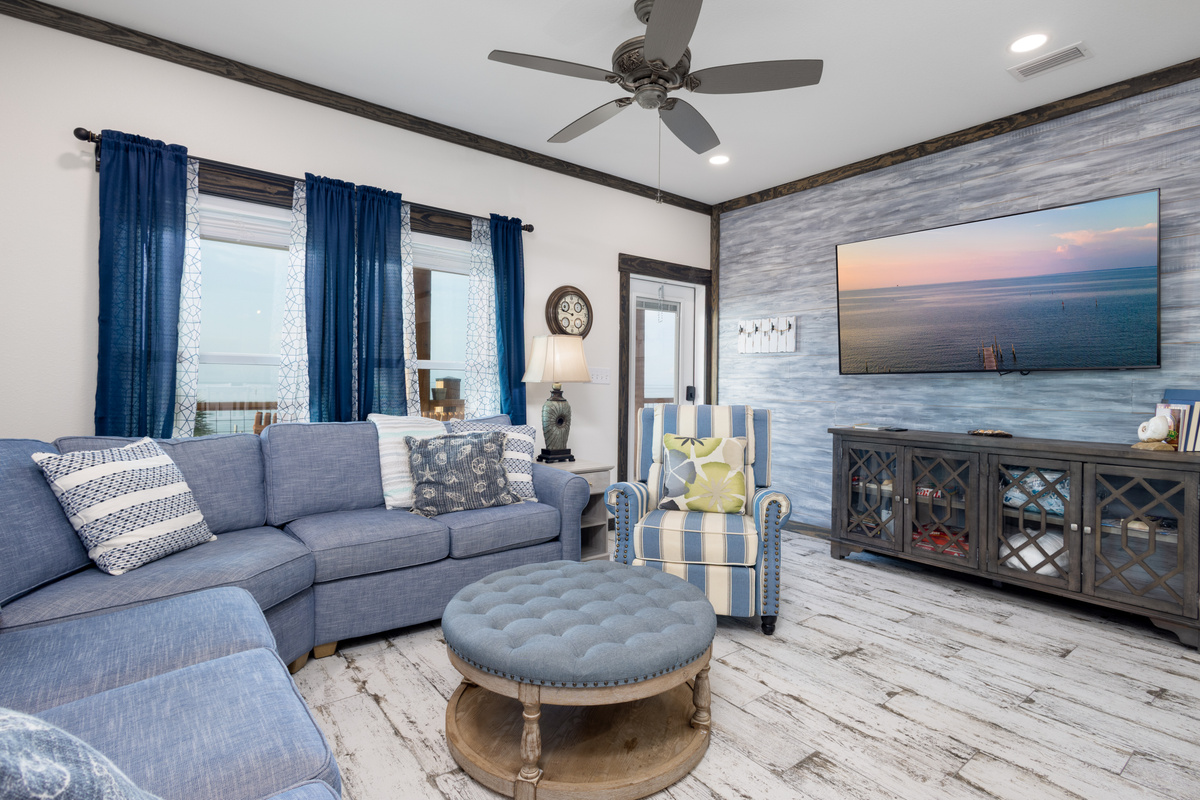 Large tv and plenty of seating with sleepre sofa