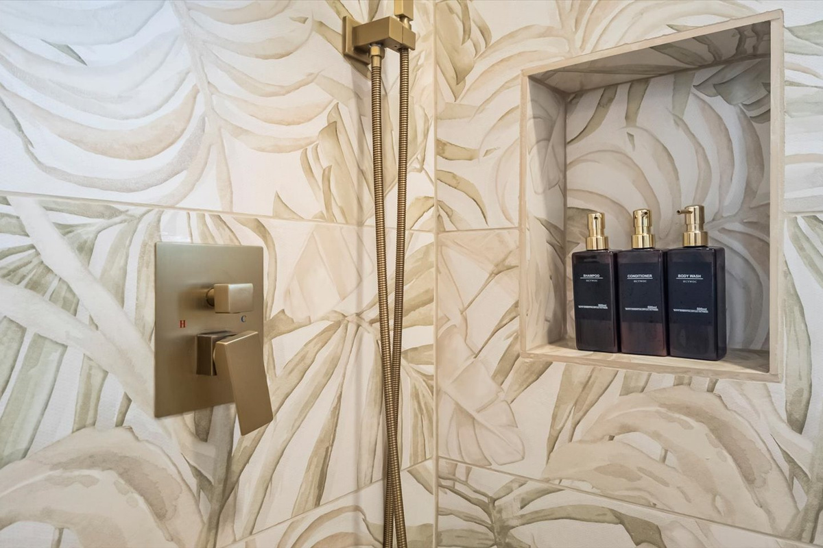 Shampoo, conditioner, body wash, and toilet paper are provided. 