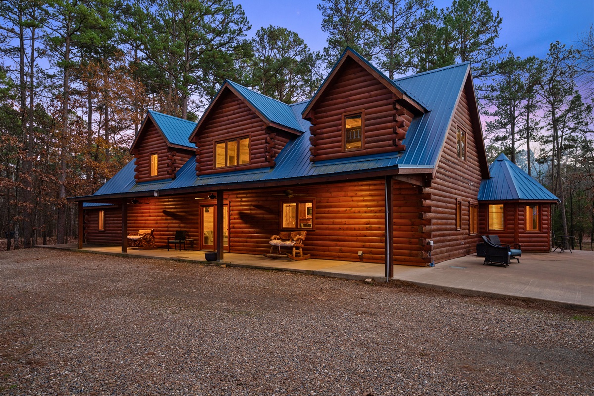 From this angle, the cabin blends seamlessly into the natural landscape, surrounded by forest on all sides.
