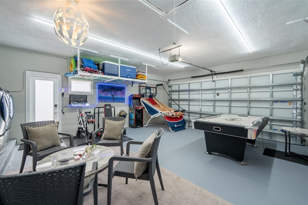 Private game room with pool table, arcade & lounge area