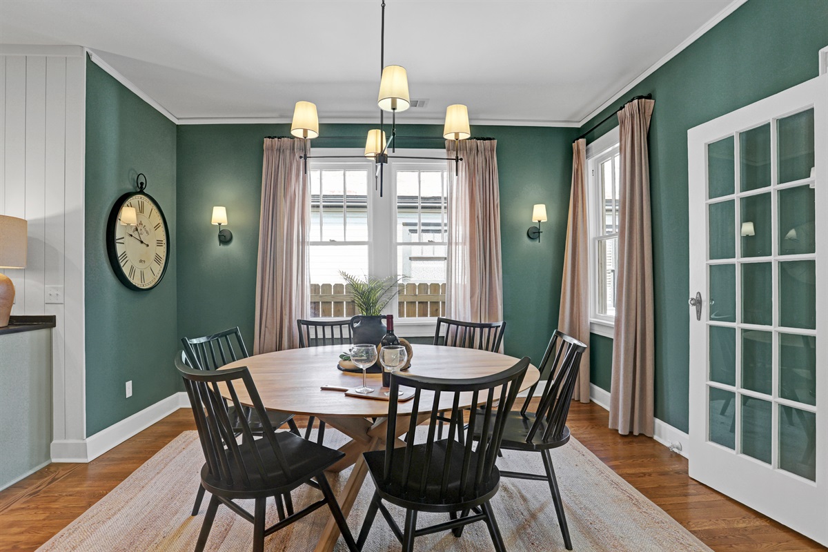 A spacious round table comfortably seats six—perfect for shared meals, game nights, or morning coffee chats.