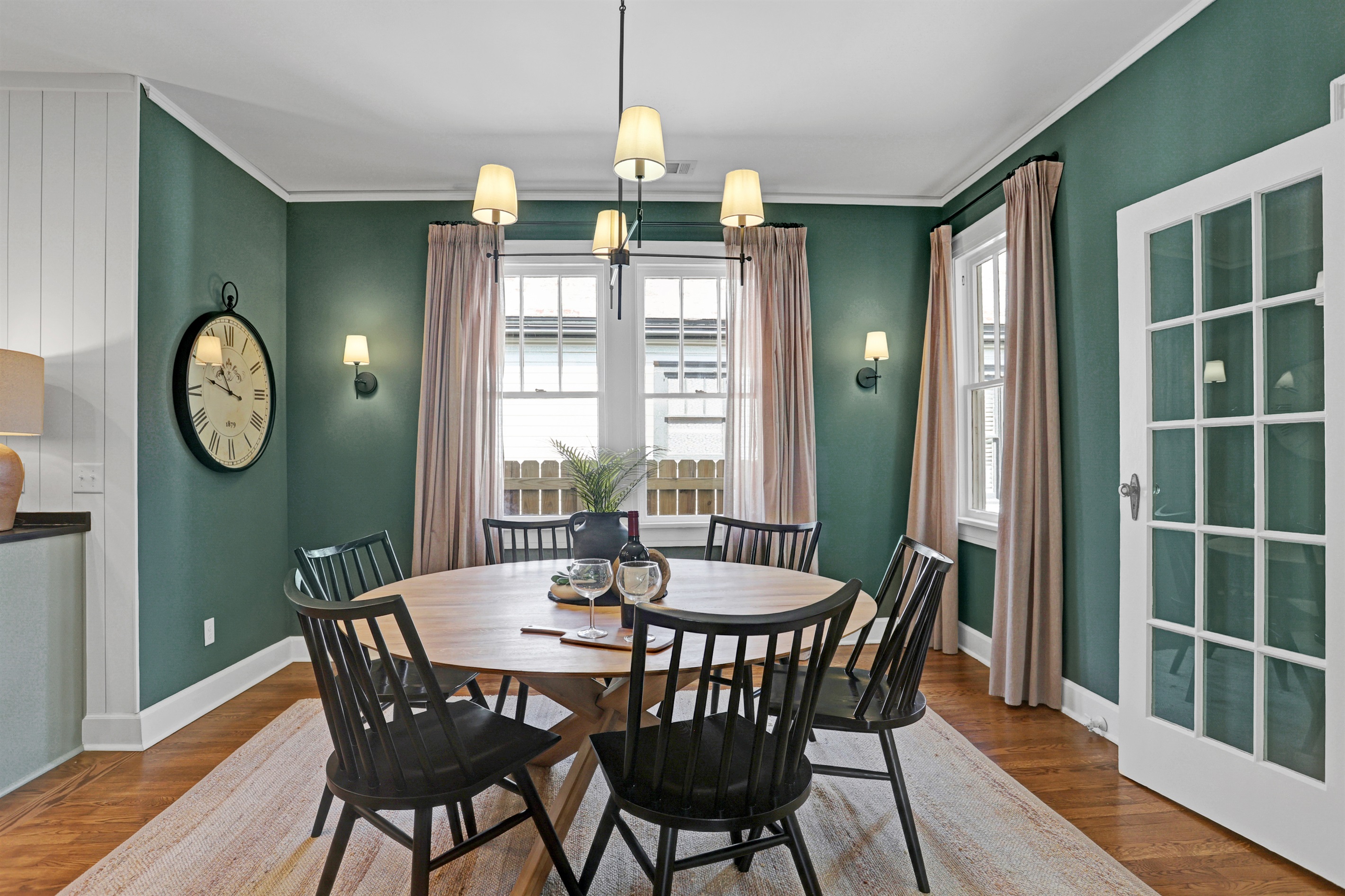 A spacious round table comfortably seats six—perfect for shared meals, game nights, or morning coffee chats.