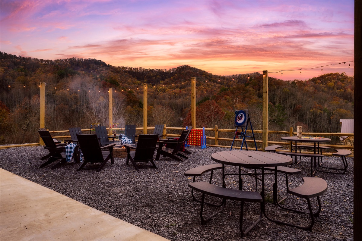 Fire Pit in backyard with picnic tables & views
