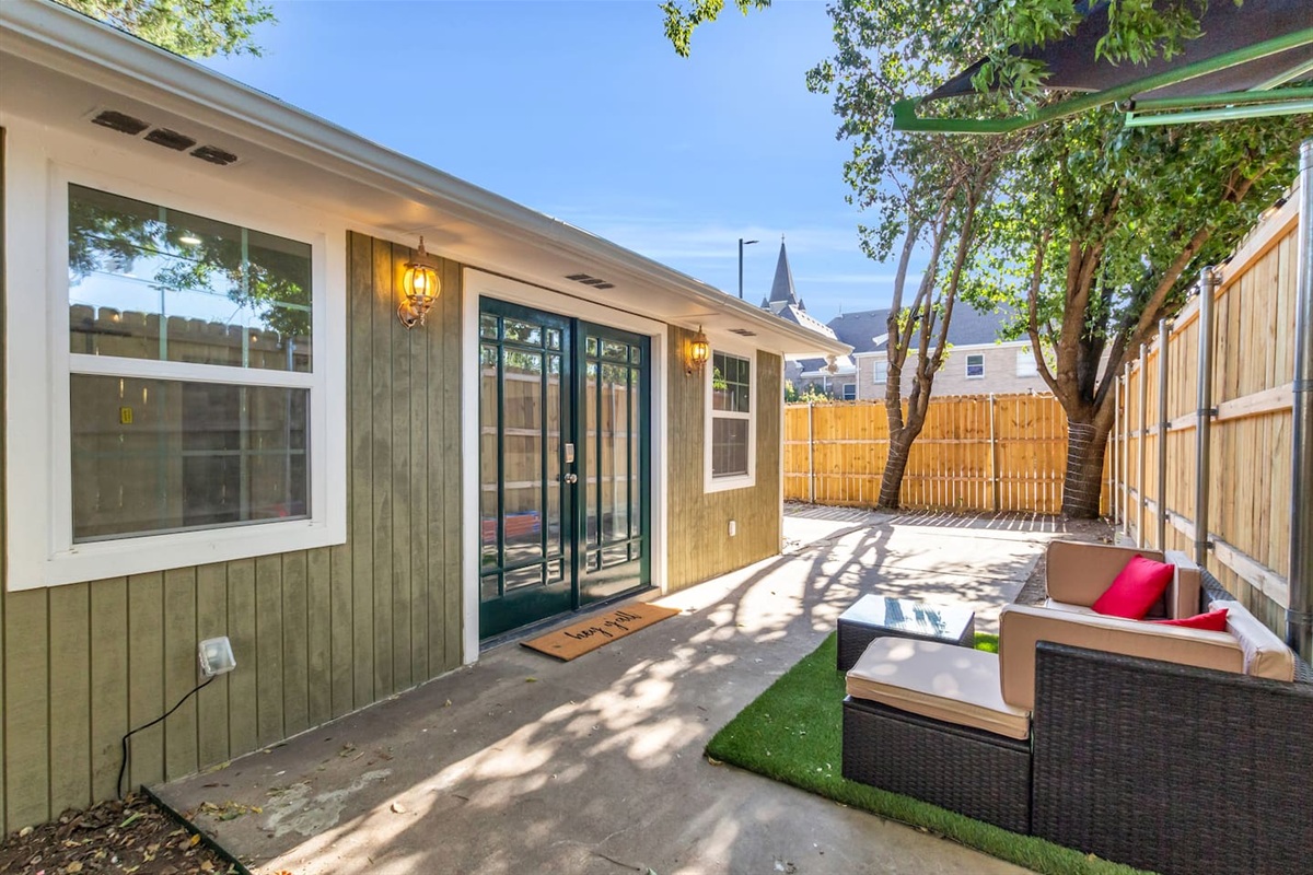 Single-level home with a private, step-free entrance through elegant double doors overlooking the front patio.