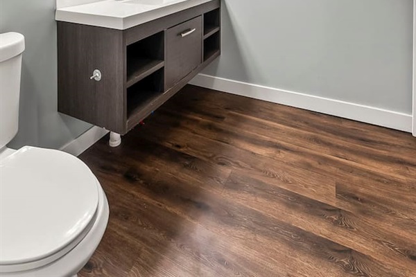 Spacious bathroom layout with modern finishes, bright lighting, and easy access to laundry facilities.